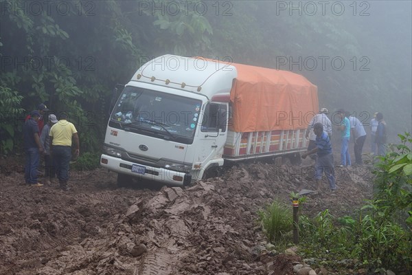 Truck stuck in mud on Ruta 3 in fog