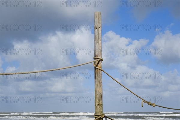 Wooden pole with rope for demarcating the bathing area