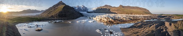 Glacial river in front of Mountains with Hvannadalshnukur