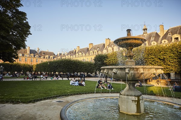 Evening atmosphere with fountains in front of medieval facades