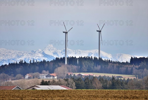 Wind turbines against the backdrop of the Alps