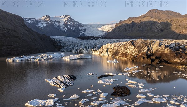 Glacial river in front of Mountains with Hvannadalshnukur