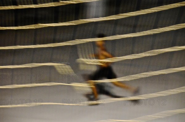 Runner in front of volleyball net