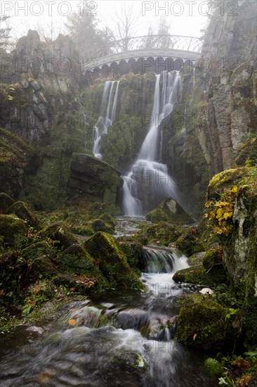 Devil's Bridge with waterfall in autumn