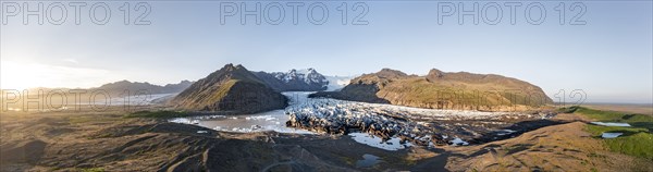 Glacial river in front of Mountains with Hvannadalshnukur