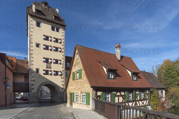 Historic water gate with town coat of arms