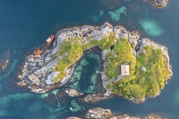 Small island and shipwreck along the Atlantic Strait