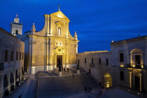 Illuminated St Marija's Cathedral in Gozo Citadel at dusk in blue hour