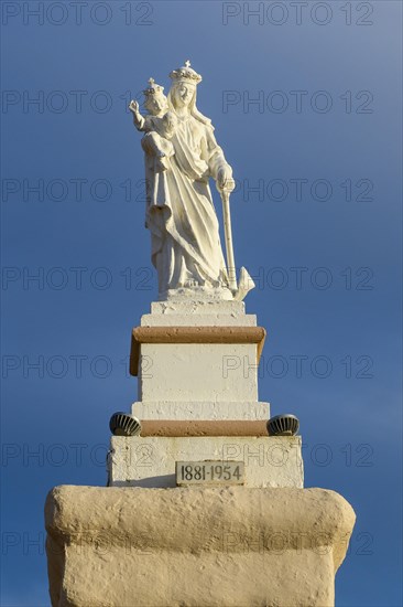 Statue of Madonna Mary Mother of God on Ramla Bay Beach