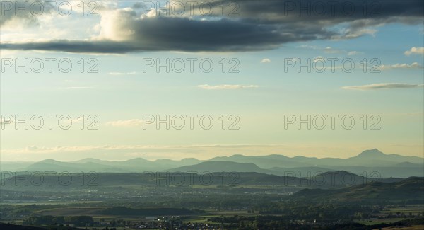View on volcanic landscape of Regional Nature Park of the Volcanoes of Auvergne at sunset