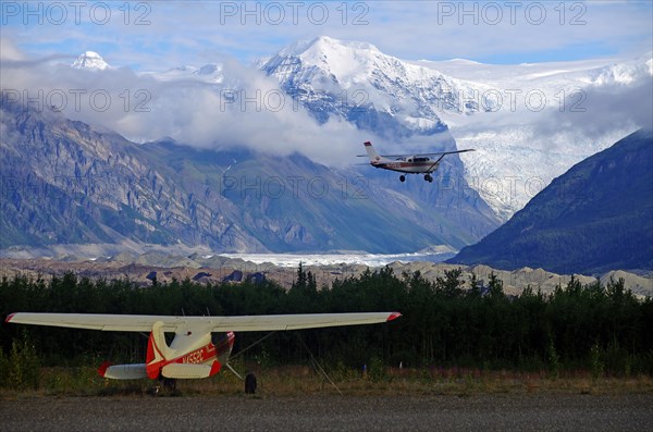 Small planes and snow-capped mountains and glaciers