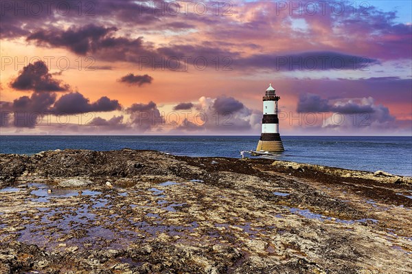 Trwyn Du Lighthouse on rocky coast