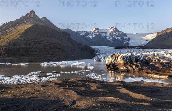 Glacial river in front of Mountains with Hvannadalshnukur