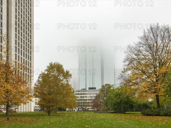 Deutsche Bank in the fog behind Rothschild Park in autumn colours