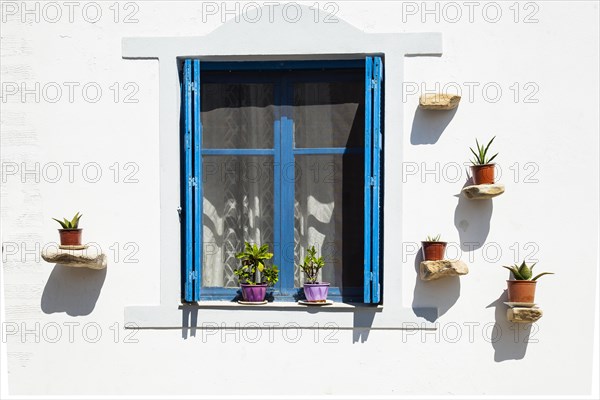 Windows facade detail of a traditional Greek house on Crete