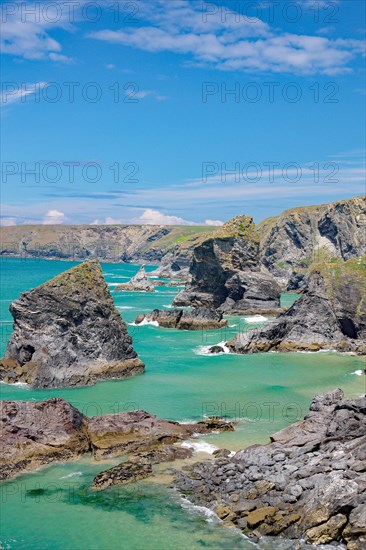 Rocks and cliffs in shallow water