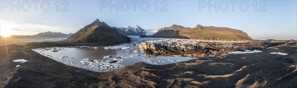 Glacial river in front of Mountains with Hvannadalshnukur