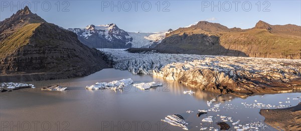 Glacial river in front of Mountains with Hvannadalshnukur