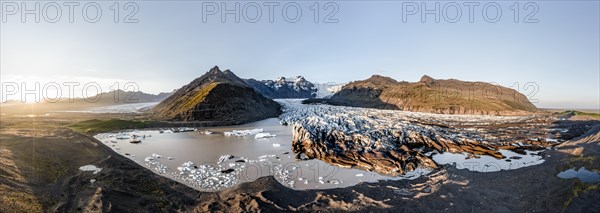 Glacial river in front of Mountains with Hvannadalshnukur