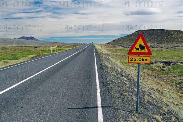 Straight road in barren landscape