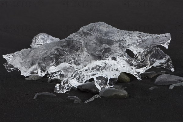 Ice structure on black lava beach