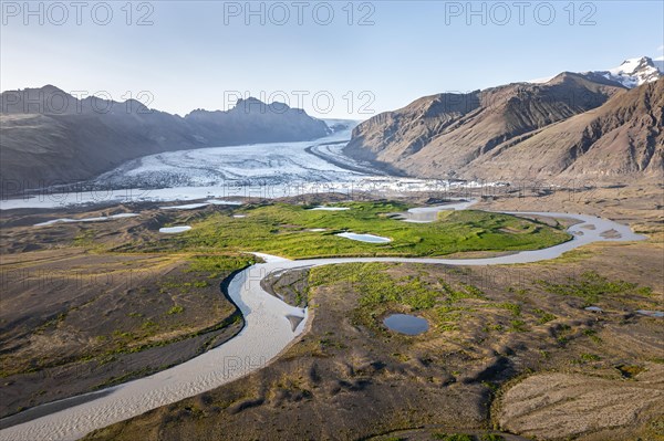 Glacier river in front of Mountains