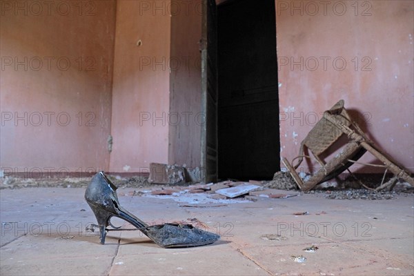 Old lady's shoe in abandoned finca