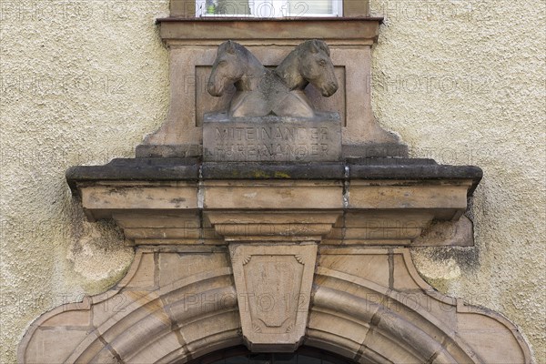 Sculptures of two crossed horse heads at a former brewery