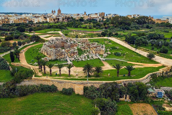 Bird's eye view of historic Neolithic Ggantija temple from temple complex of megalithic culture