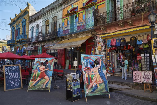 Colourful house facades and posters in the La Boca district