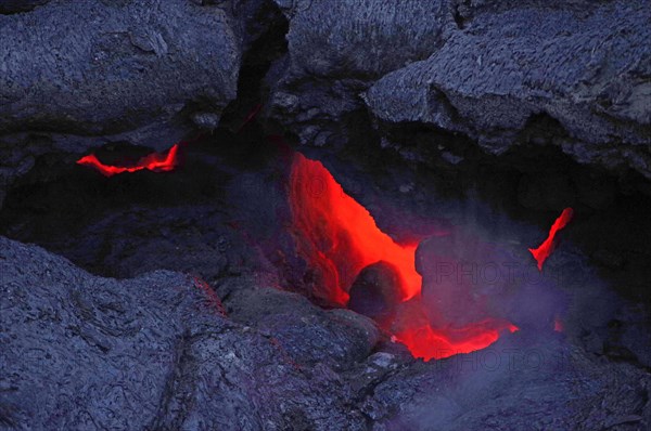 Magma glows under cooled lava