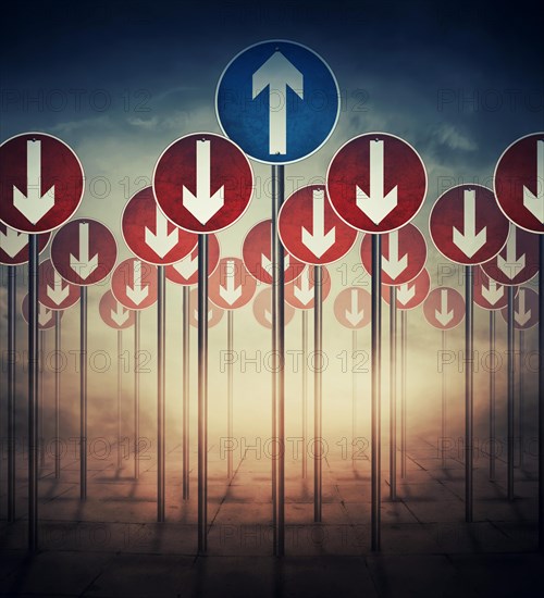 Conceptual image with a lot of road signs directed down and one arrow going up