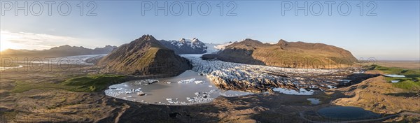 Glacial river in front of Mountains with Hvannadalshnukur