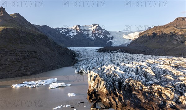 Glacial river in front of Mountains with Hvannadalshnukur