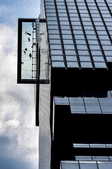 People standing on the glass floor of Maha Nakhon Tower