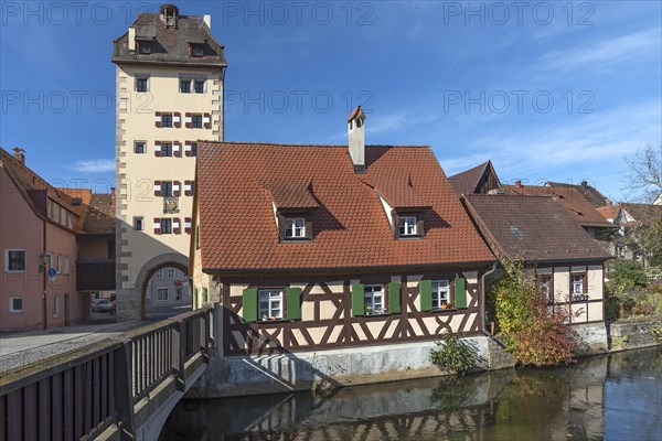 Historic water gate with town coat of arms