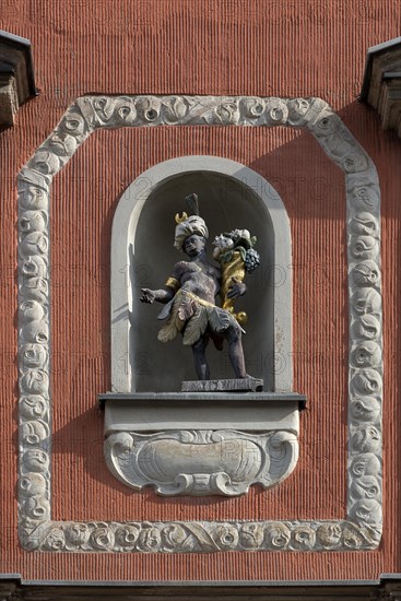 Sculpture with cornucopia in a niche on the facade of the Mohrenapotheke since 1890