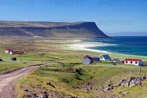 Gravel roads lead to a small village and a wide bay with sandy beach