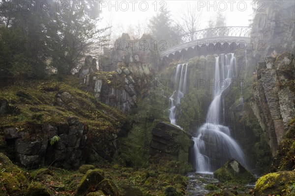 Devil's Bridge with waterfall in autumn