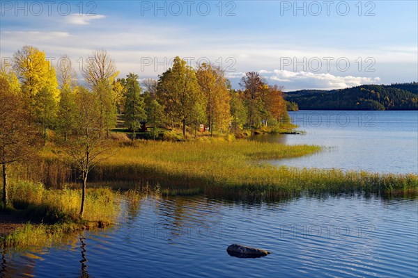 Lakeside and small cottage in the evening light