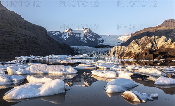 Glacial river in front of Mountains with Hvannadalshnukur