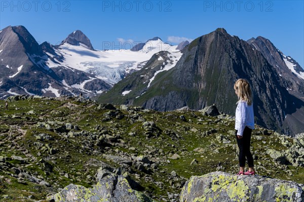 Young girl posing before the Swiss Alps