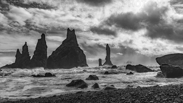 Lava rocks and rock needles on the black lava beach Reynisfjara