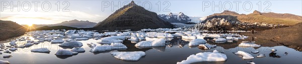 Glacial river in front of Mountains with Hvannadalshnukur