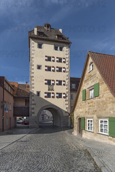 Historic water gate with town coat of arms