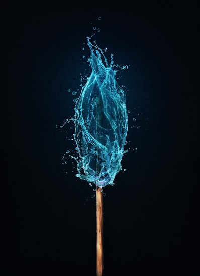 Different thinking concept as an unusual matchstick burning in a water flame