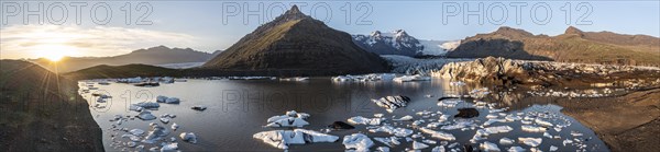 Glacial river in front of Mountains with Hvannadalshnukur