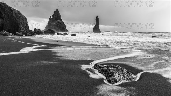 Lava rocks and rock needles on the black lava beach Reynisfjara