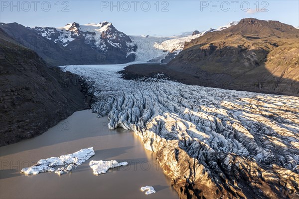 Glacial river in front of Mountains with Hvannadalshnukur