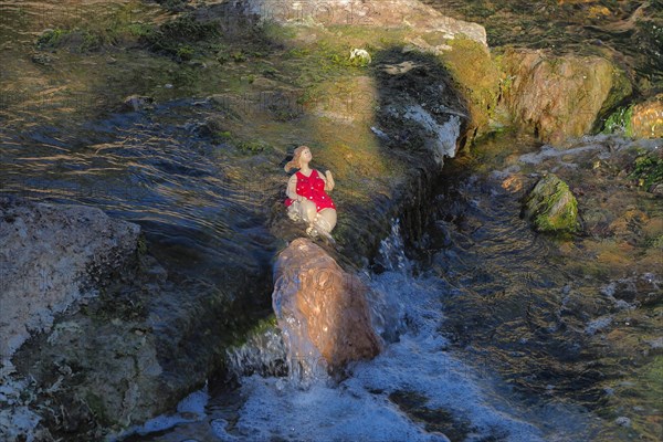 Bathers by the waterfall